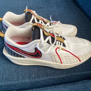 Nike White and Black Sneakers with Red and Gold Details